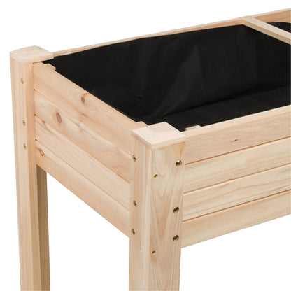 A close-up of a wooden raised garden bed frame with a black fabric liner, showing the natural wood grain and metal fasteners against a white background. 