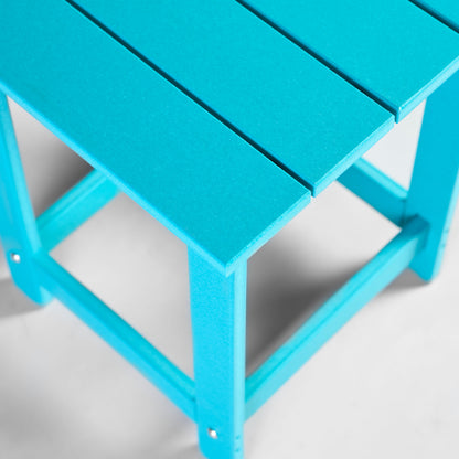 A close-up of a bright turquoise blue slatted plastic small table with a matching frame, photographed on a clean white background. 