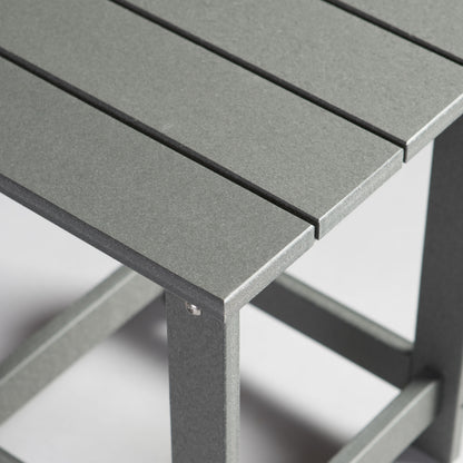 Close-up of a gray outdoor table with a blurred background 