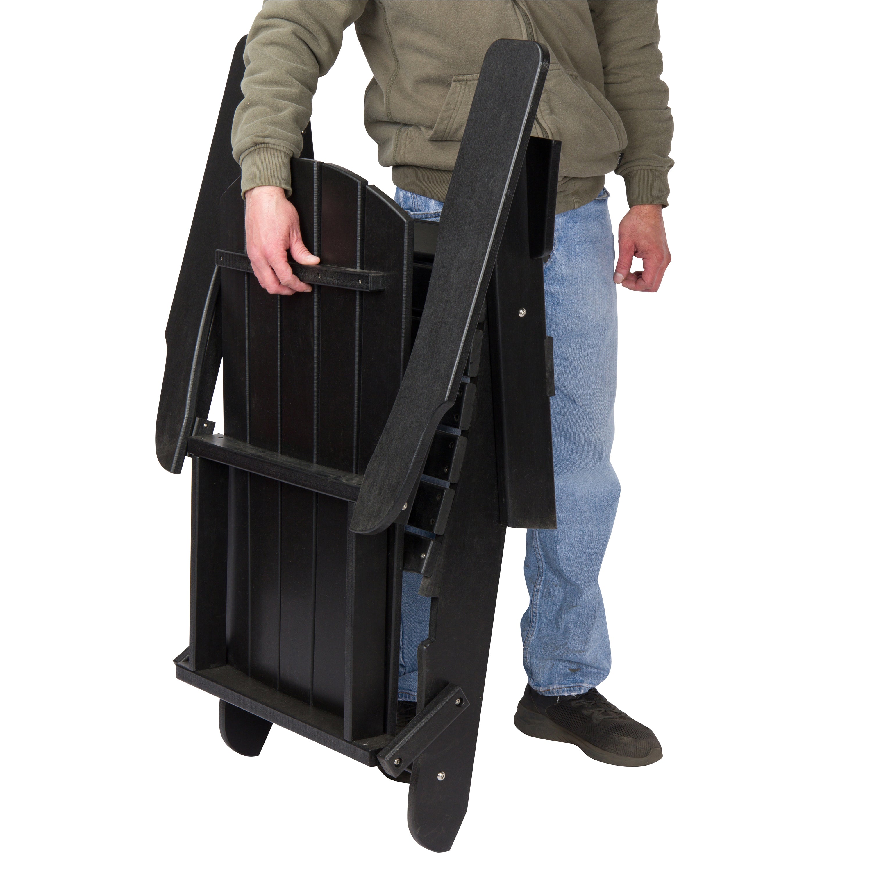 A person holding a black folding patio chair against a plain white background. 