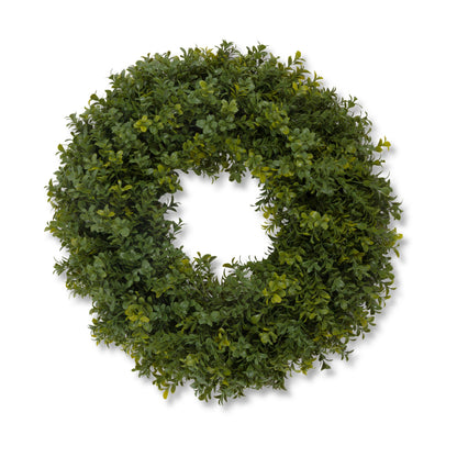 An artificial green boxwood leafy wreath with realistic dense foliage, shown against a plain white background.