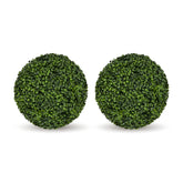 Two round green artificial topiary ball decorations on a plain white background.